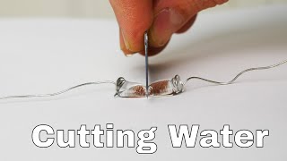 Superhydrophobic Knife Slices Water Drops in Half [upl. by Cychosz994]