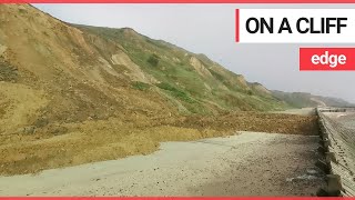 Dramatic footage shows huge landslide on a quiet beach  SWNS TV [upl. by Nyleve]