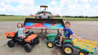 Filling our tractors with TONS of water balloons  Tractors for kids [upl. by Lari685]