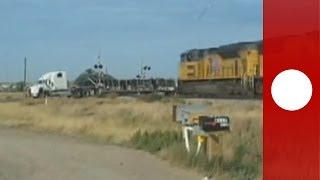 Dramatic footage Train hits trailer truck stuck on tracks Holy smokes says witness [upl. by Puff]