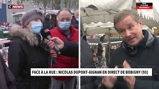 Nicolas DupontAignan dans face à la rue sur le marché de Bobigny au micro de Morandini 03022022 [upl. by Giorgia]